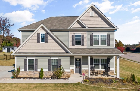 Well-maintained modern home with a newly upgraded roof and clean exterior, showcasing curb appeal and value for Tulsa homeowners.