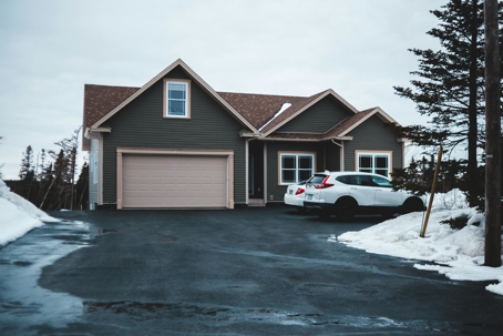 Snow-covered home with a well-maintained roof prepared for winter storms in Tulsa, OK
