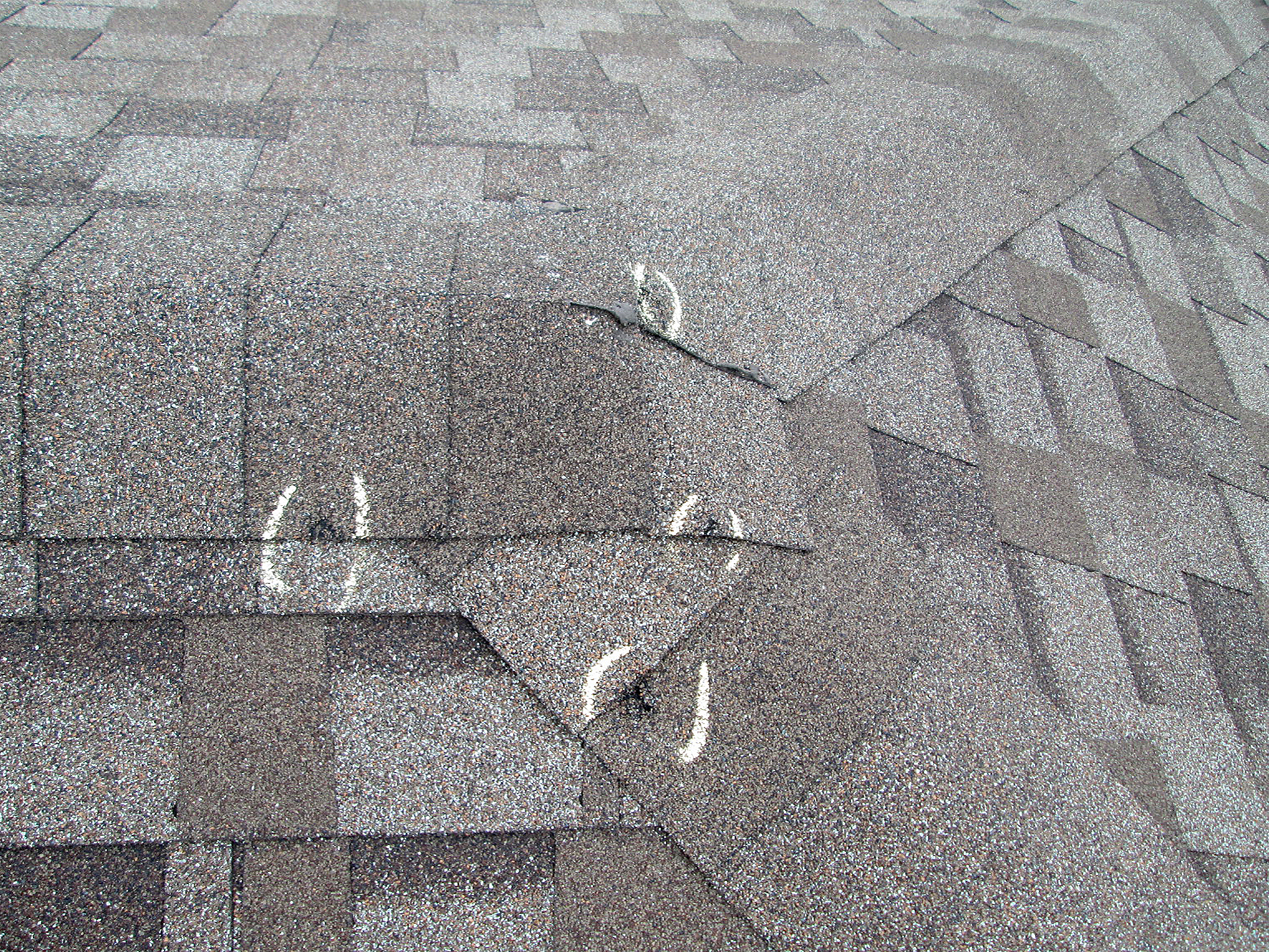 What hail damage on an asphalt roof looks like